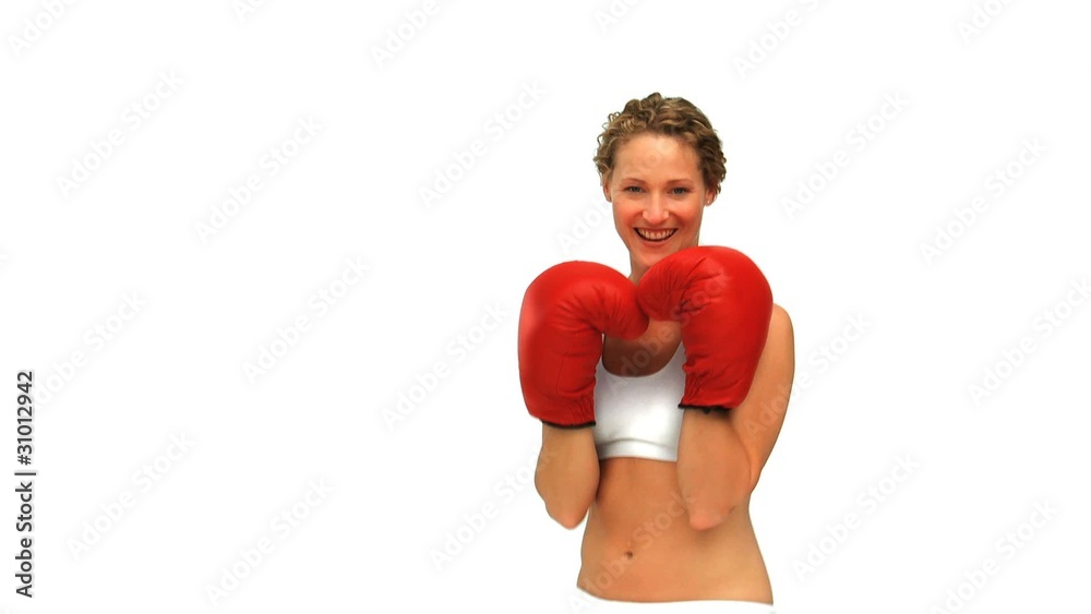 Curly haired woman with boxing gloves Curly haired woman with boxing gloves
