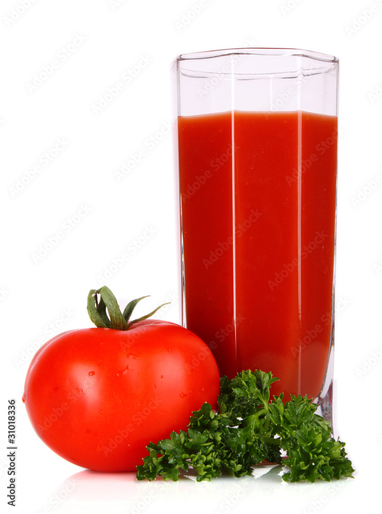 Glass of fresh tomato juice and tomatoes round the glass on th Glass of fresh tomato juice and tomatoes round the glass on th