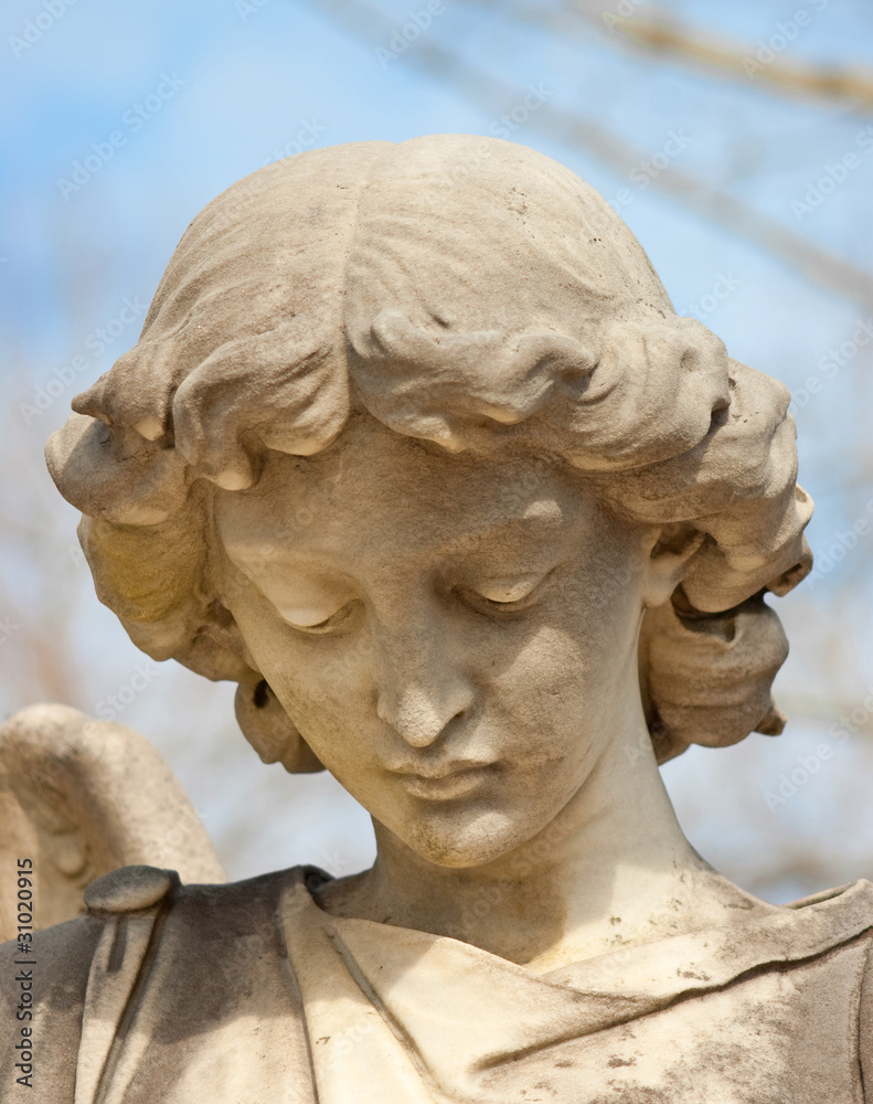 Sorrowful angelic statue