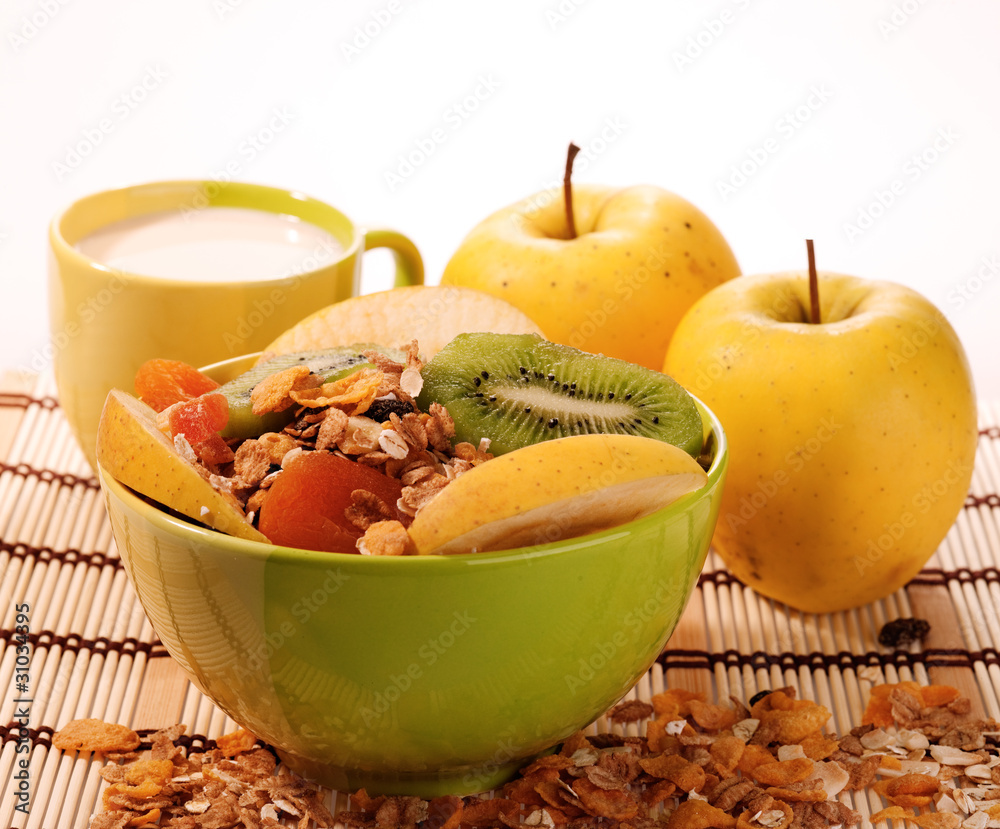 cuisine still-life. muesli with milk and fruits over white cuisine still-life. muesli with milk and fruits over white