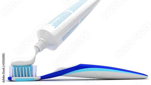 Squeezing toothpaste onto toothbrush photo