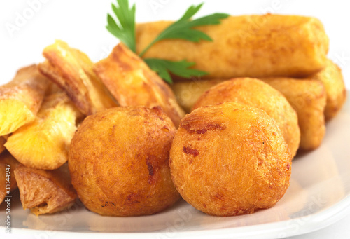 Filled fried balls and sticks out of manioc
