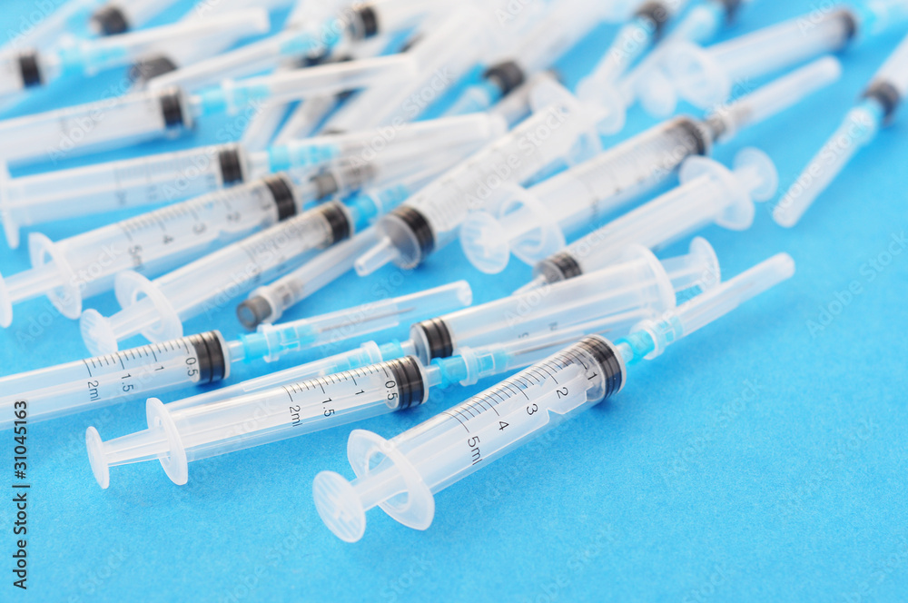 Syringes in the blue background