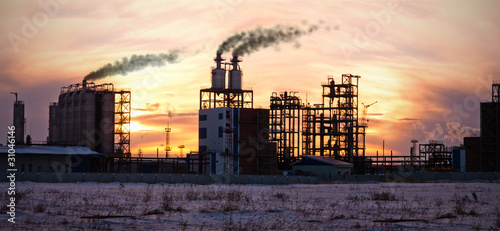 Oil refinery at sunset. Enviroment pollution. © TebNad