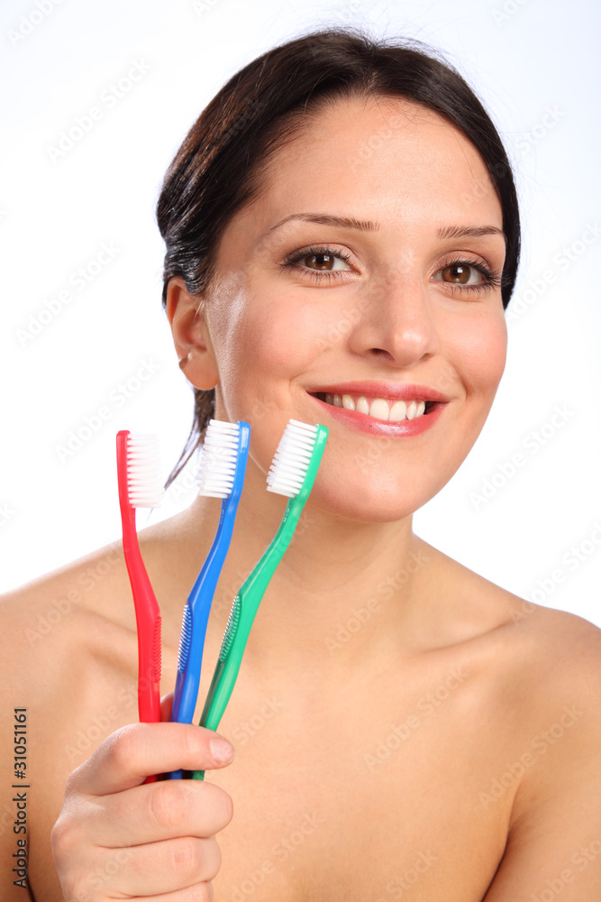 Smiling beautiful young woman with toothbrushes Smiling beautiful young woman with toothbrushes