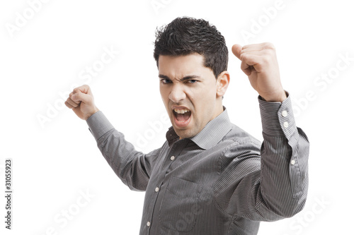 Happy young man with arms up isolated on a white background