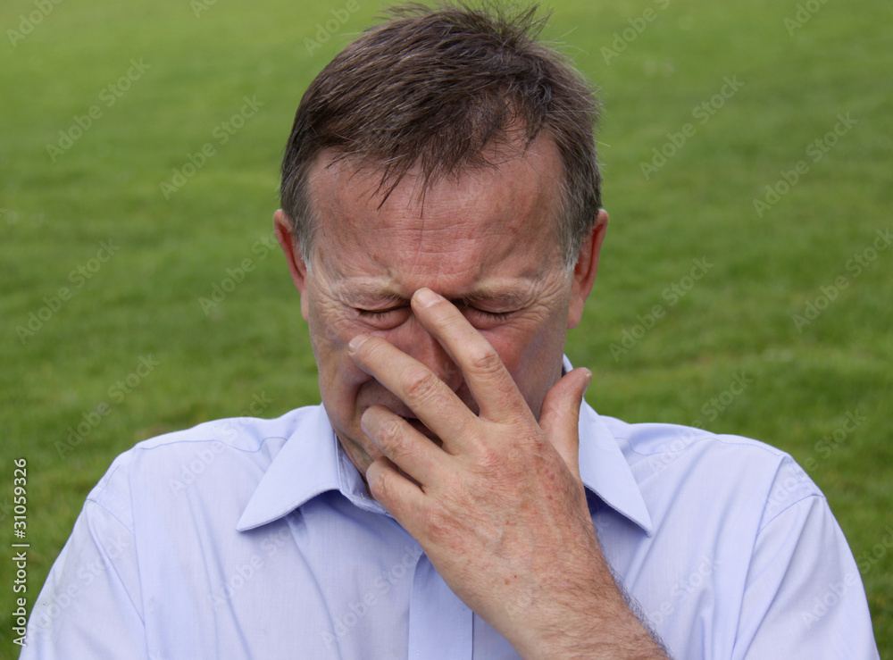 Business man crying after being made redundant