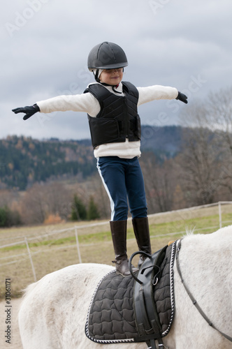 Horse riding - little girl stunt riding