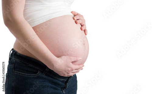 pregnant woman holding her belly © ventura
