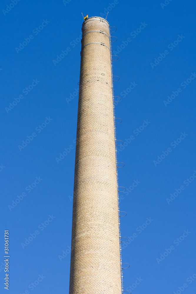 Chimney against the blue sky.