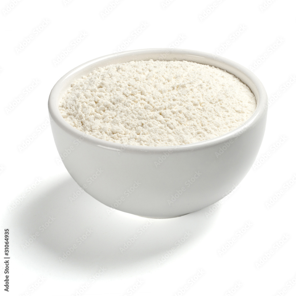 Wheat flour in a plate on white background Wheat flour in a plate on white background