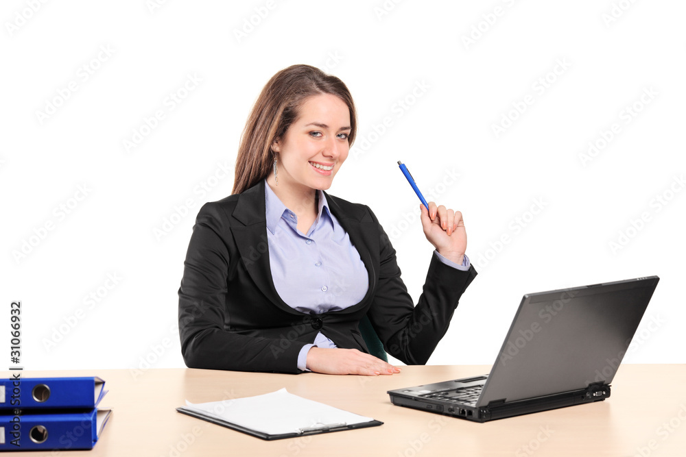 A young businesswoman working on a laptop A young businesswoman working on a laptop