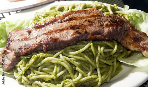 green spaghetti tallarin saltado steak Peruvian food