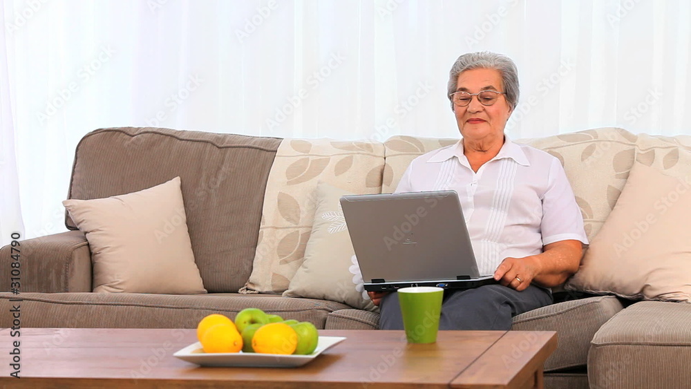 Mature woman working on her laptop Mature woman working on her laptop