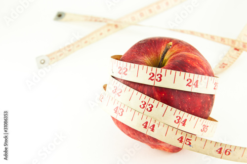 Red apple with tape isolated on white (good shape and good healt