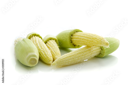 Group of baby corns isolated on white background