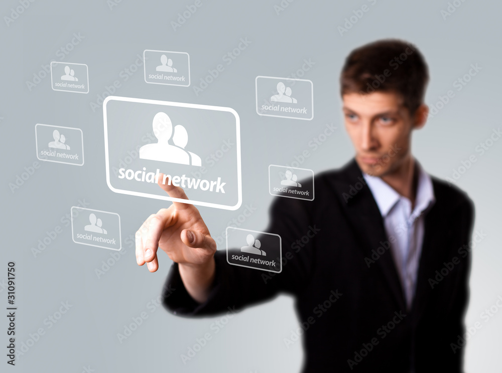 Businessman hand pressing Social network sign Businessman hand pressing Social network sign