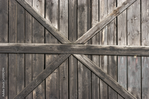 Old wooden door with big cross for background