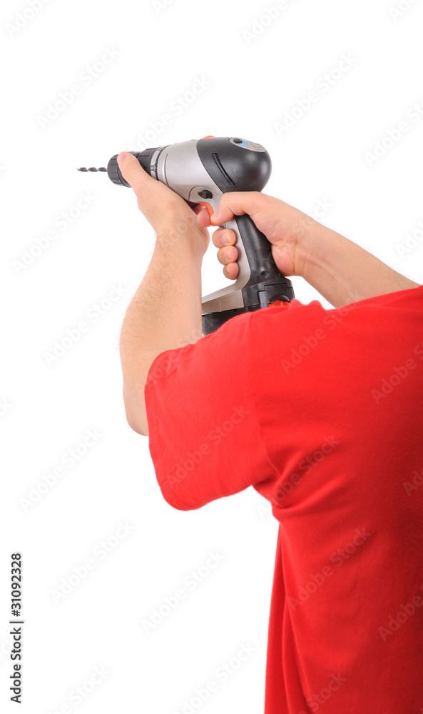 Manual worker using battery drill isolated on white background. Manual worker using battery drill isolated on white background.
