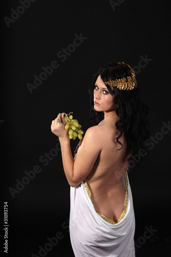 Ancient greece woman with a bunch of grapes photo