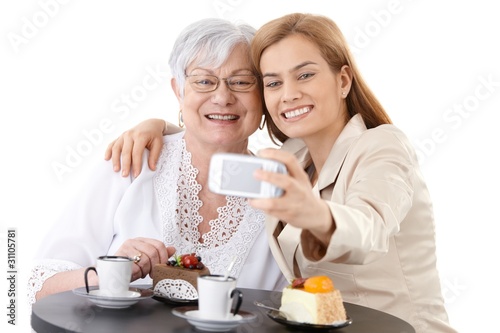 Mother and daughter photographing themselves