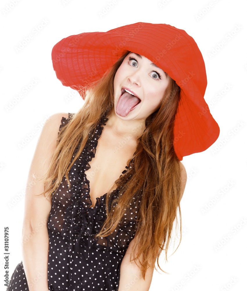 Woman in red hat shows her tongue Woman in red hat shows her tongue