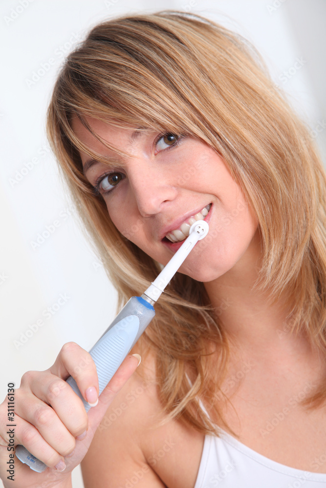Portrait of beautiful woman brushing her teeth Portrait of beautiful woman brushing her teeth