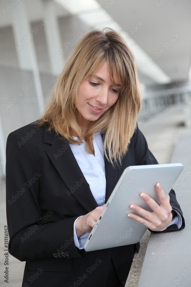 Smiling businesswoman with electronic tablet Smiling businesswoman with electronic tablet
