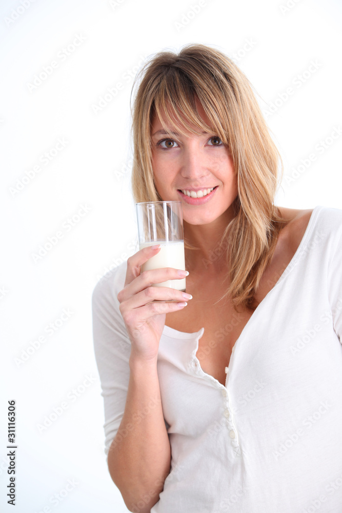 Beautiful woman holding glass of milk Beautiful woman holding glass of milk