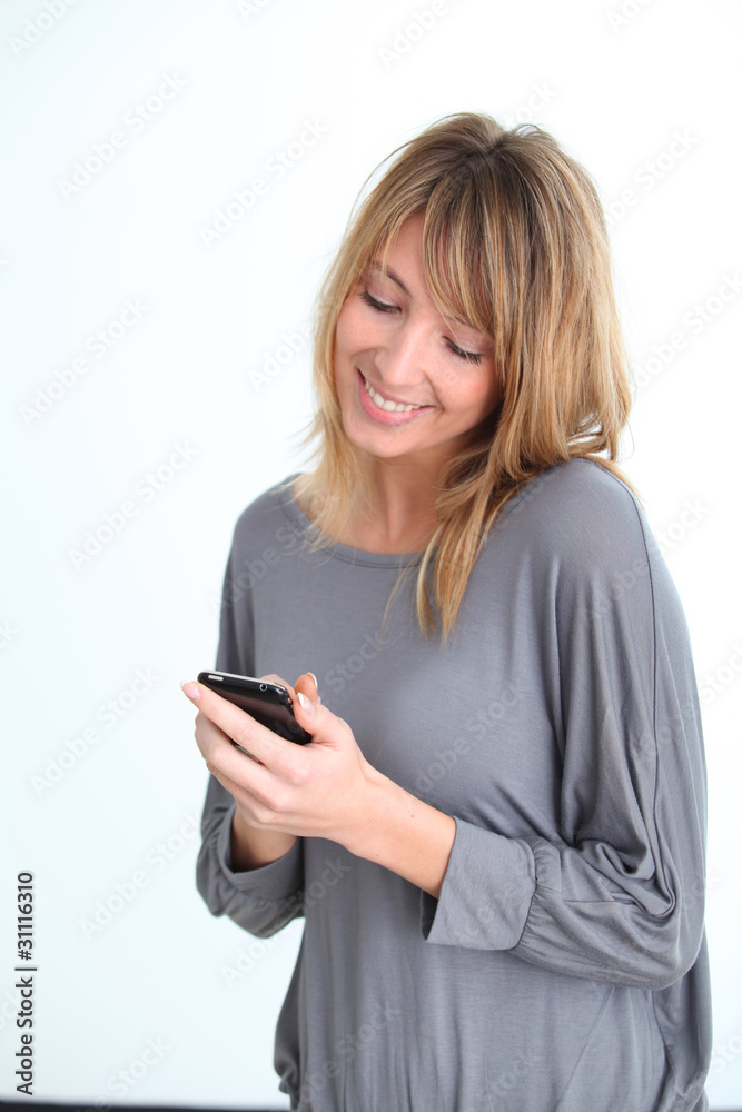 Beautiful woman sending short message Beautiful woman sending short message