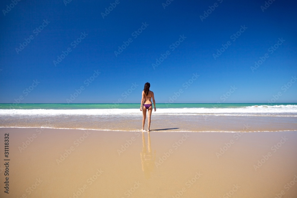 walking towards water at seashore