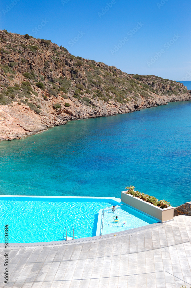 Swimming pool and beach at the luxury hotel, Crete, Greece