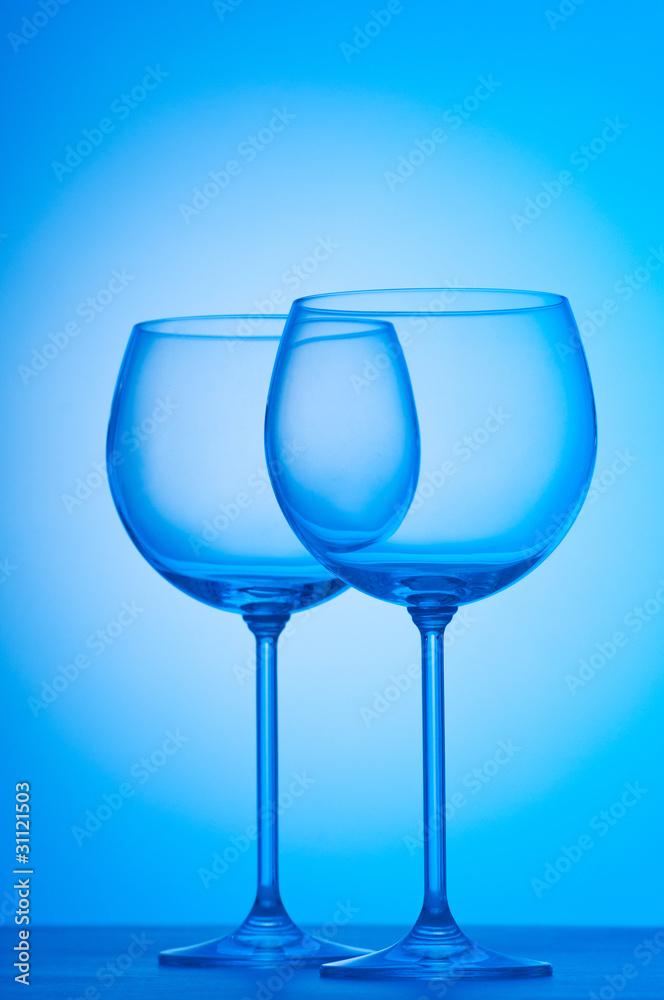 Wine glasses against gradient background Wine glasses against gradient background