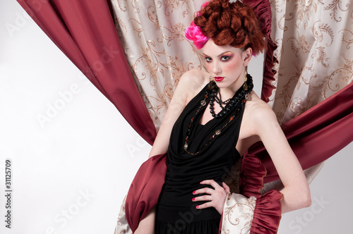 Closeup portrait of fashion woman posing with silck fabric