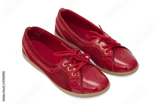 Red shiny shoes on white background.