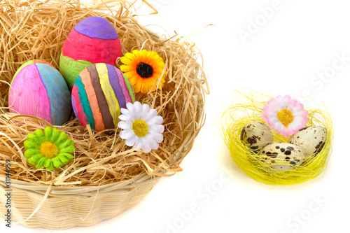 Colorful Easter eggs with flowers in the basket