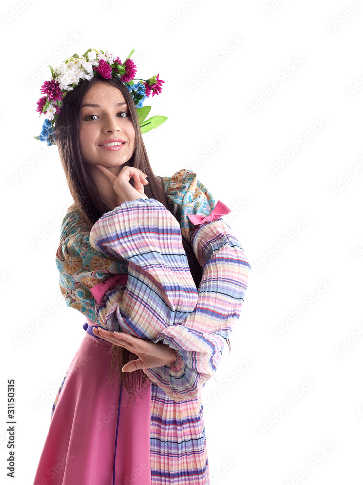 Beauty girl with garland posing in russian costume