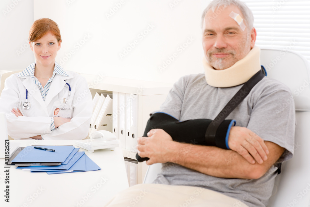 Senior patient broken arm in doctor office Senior patient broken arm in doctor office
