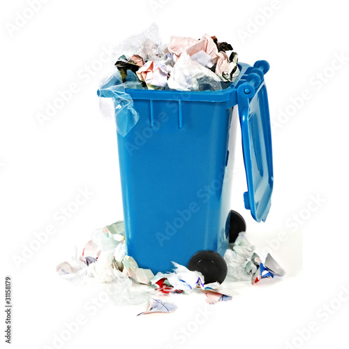 overflowing blue garbage bin