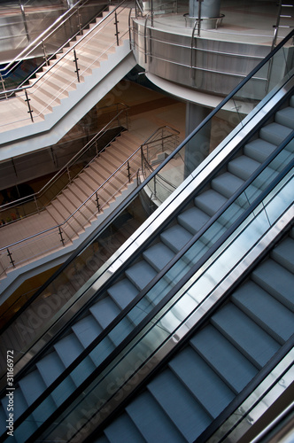 escalators and stairs in a modern office building