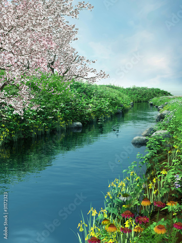 Fototapeta Wiosenna sceneria z rzeką i kwitnącymi drzewami