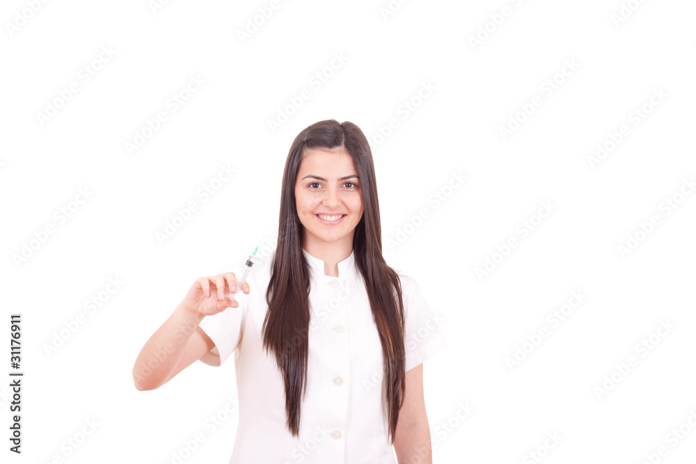 Smiling nurse showing a syringe isolated Smiling nurse showing a syringe isolated