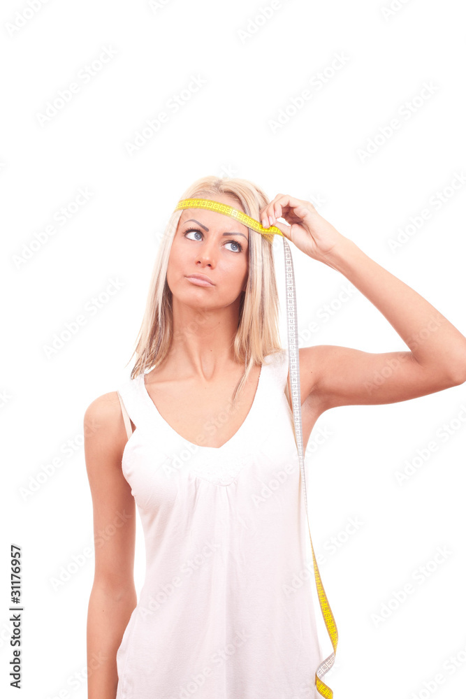 Fitness girl having a measuring meter and thinking isolated Fitness girl having a measuring meter and thinking isolated