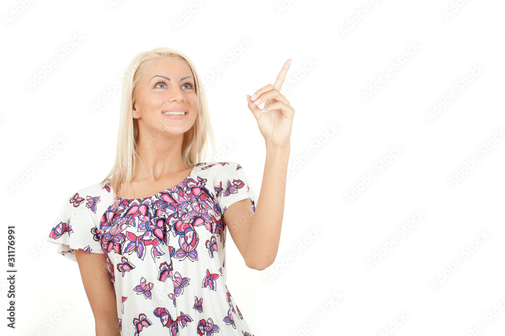 Attractive girl looking up and pointing her finger isolated Attractive girl looking up and pointing her finger isolated