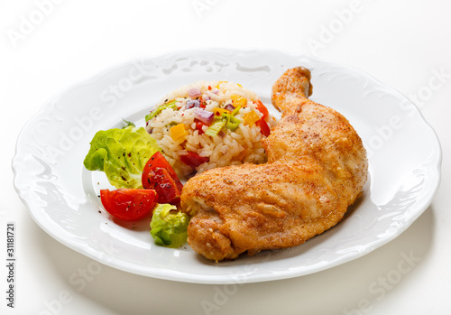 Roasted chicken leg, rice and vegetables