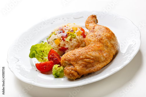 Roasted chicken leg, rice and vegetables