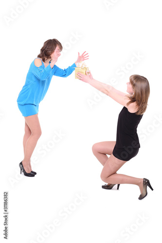 girl gives to the friend a gift on birthday. It is isolated