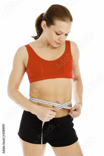 Sports woman measures her waist © Nobilior