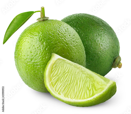 Isolated limes. Two whole lime fruits with leaves and a piece isolated on white background