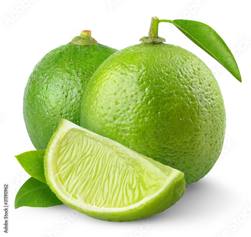 Isolated limes. Two fresh lime fruits and a slice isolated on white background